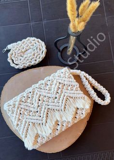 two woven bags sitting on top of a wooden table