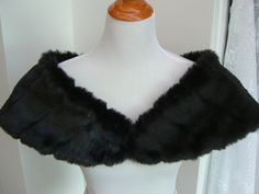 "I made this shoulder shrug out of black mink faux fur and lined the wrap with black fleece for warmth and comfort. The shawl is 43\" long on the upper cut, cut on a curve for a better fit, and 8\" wide(long) at the back. You can pin in place or add your own special piece of pinned jewelry for a perfect fit. Spot clean or dry clean. Optional hook and eye closure available." Fur Stole Wedding, Black And White Makeup, Faux Fur Shrug, Faux Fur Shawl, Fur Shrug, Faux Fur Stole, Shoulder Cape, Fur Wrap, Shoulder Wrap