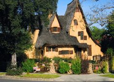 an old style house with a thatched roof