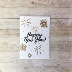 a new year's card with fireworks and the words happy new year on it