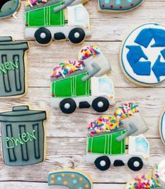 decorated cookies are arranged in the shape of garbage trucks and recyclables