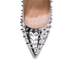 Genuine leather upper and insole; rubber outsole Point toe Spikes all over the shoes Pink sole 4" heel (10 cm, approximately) Silver Pointed Toe Heels With Studs, Silver Heels With Spikes For Formal Occasions, Silver Spiked Heels For Formal Occasions, Party Heels With Rubber Sole And Closed Toe, Party Heels With Rubber Sole, Closed Toe, Closed Toe Party Heels With Rubber Sole, Closed Toe Heels With Rubber Sole For Party, Party Heels With Rubber Sole, Formal Spiked Closed Toe Heels