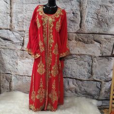 This Elegant 2 Pieces Red And Gold Embroidered Abaya Features Intricate Gold Ornate Embroidery Along The Neckline, Down The Front, And On The Edges Of The Sleeves And The Bottom Hem. The Set Includes One Dress And A Long Embroidered Kimono/Goddess Duster/Cover Up. Size: Large Bust:46" Hips:48" Length:58" Sleeves: 28" Red Kaftan With Zari Work For Festivals, Festive Red Kaftan With Resham Embroidery, Red Festive Kaftan With Zari Work, Festive Red Kaftan With Zari Work, Red Anarkali Kaftan For Festive Occasions, Red Zari Work Kaftan For Eid, Red Floor-length Traditional Wear With Floral Embroidery, Red Dabka Work Kaftan For Eid, Elegant Red Kaftan With Zari Work