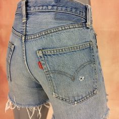 Rare! 1970's Authentic selvedge redline Levi's, button stamp #6 Brand: LEVIS 501  Fits like 27" waist, 11.25" rise, 22 thighs, 38.5" hips, 3" inseam,! Fits a size 27, but check your measurements and compares the measurement with your garment. (see full measurement below) Recommended waist size: 27" Material :  Cotton 100% Button #6 Selvedge Jeans Made In USA NOT YOUR SIZE? LOOK OTHER LISTING ✂-- www.etsy.com/shop/AberyApparelClothing Distressed Thrashed Cutoff Short Light Wash Selvedge Jeans Tru Retro Straight Leg Shorts With Pockets, Retro Straight Leg Jean Shorts With Pockets, Vintage High Rise Bottoms With Pockets, High Waist Distressed Retro Bottoms, Retro High Waist Distressed Bottoms, Vintage Distressed Cutoff Bottoms, Vintage Cutoff Bottoms With Belt Loops, Retro Distressed Cutoff Bottoms, Vintage Fitted Cutoff Jean Shorts