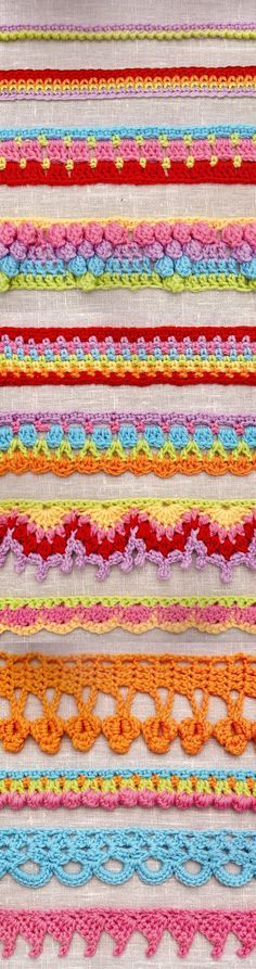 multicolored crochet laces are stacked on top of each other in rows