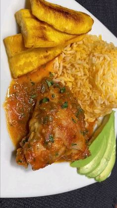 a white plate topped with rice, meat and veggies next to sliced bananas