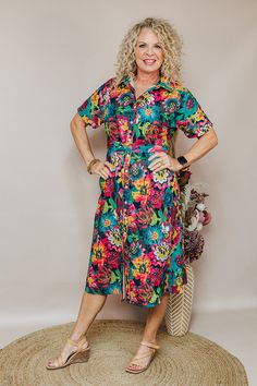 Dresses are a girl's best friend! The Vanessa Dress is a floral button-down midi dress in a floral print with a tie around the waist. Pair with heels or sneaker for whatever look your going for! Available in Sizes: X-Small, Small, Medium, Large, X-Large, 2X Michaelle is wearing a X-Small Fabric: 100% Polyester Fit: You Can Usually Size Down In Layerz Clothing Brand: Layerz Clothing Spring Tropical Print Midi Floral Dress, Multicolor Midi Shirt Dress For Spring, Spring Midi Dress With Tie Waist For Casual Wear, Spring Tropical Print Midi Dress For Day Out, Spring Midi Dress With Tropical Print For Day Out, Spring Floral Print Shirt Dress, Spring Shirt Dress With Tie Waist For Casual Days, Spring Shirt Dress With Tie Waist For Casual Occasions, Spring Shirt Dress With Tie Waist For Casual Wear