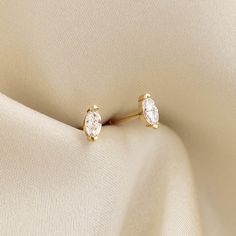 Marquise-cut diamond stud earrings, set in 14k yellow gold—classic and elegant! 


Marquise-cut diamonds measure 4mm x 2mm 

0.16 total carat weight

Butterfly back closure Delicate 14k Gold Diamond Earrings For Formal Occasions, Yellow Gold Marquise Cut Earrings As Gift, Yellow Gold Marquise Cut Earrings For Gift, Formal 14k Gold Delicate Diamond Earrings, Gold Marquise Brilliant Cut Diamond Earrings, Classic Gold Marquise Cut Diamond Earrings, Marquise Diamond Cut Earrings For Anniversary, Gold Marquise Diamond Earrings With Brilliant Cut, Elegant Marquise Single Cut Diamond Earrings