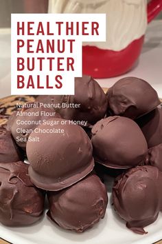 chocolate peanut butter balls on a plate with the words healthier peanut butter balls above them