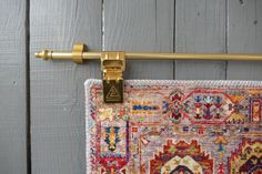 a close up of a rug hanging on a hook