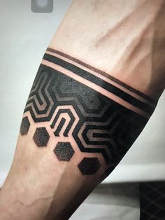 a man's arm with a black and white pattern on the inside of it