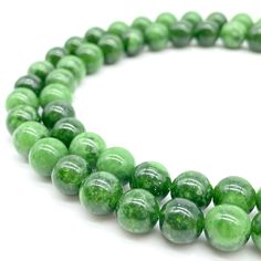 PRICES MAY VARY. Introducing our exquisite Round Russian Siberian Nephrite Jade Beads! Our beads are of premium quality, completely natural, and have not been dyed or color enhanced. Each package contains one strand of loose beads, measuring 15.5 inches, with consistent hole sizes and shapes. Please note that the clasp is not included in the package. Our round jade beads are of unparalleled quality and are perfect for crafting jewelry, making artistic creations, and decorative purposes. Their un Green Natural Stone Beads, Green Hand-strung Round Beads, Green Round Hand-strung Beads, Hand-strung Green Round Beads, Hand-strung Round Green Beads, Crystal Chakra, Chakra Energy, Crafting Jewelry, Ruby Zoisite