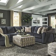 a living room filled with furniture and decor