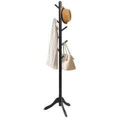 a coat rack with hats and purses hanging from it's sides, against a white background