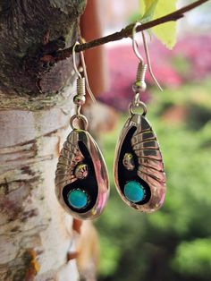 Circa 2000, Native American sterling silver teardrop turquoise earrings.  Turquoise measures approx. 38 x 14mm. Weighs 4.6 grams. Marked Sterling & "TCM". Older patina is prevalent; however, polishing can be provided prior to shipping with an extra fee, should you desire. Thanks for looking. ERA - Circa 2000, Vintage METAL / MATERIAL - Sterling Silver  MARKINGS / HISTORY - Marked Sterling & "TCM".  CONDITION - The overall condition is very good! A true representation of 2000s-era jewelry! SIZE / MEASUREMENTS - Turquoise measures approx. 38 x 14mm. Weighs 4.6 grams. VINTAGE/ANTIQUE/HANDMADE - This item is VINTAGE. Add this timeless piece to your estate collection, to your wardrobe to jazz up any outfit, or gift it to an admirer of all things vintage and heirloom. Thanks for looking! DISCLAI Southwestern Turquoise Teardrop Earrings For Gift, Unique Teardrop Sterling Silver Earrings, Turquoise Nickel-free Southwestern Teardrop Earrings, Artisan Teardrop Jewelry Stamped 925, Artisan Teardrop-shaped Sterling Silver Jewelry, Polished Sterling Silver Teardrop Earrings, Sterling Silver Teardrop Pendant For Pierced Ears, Sterling Silver Teardrop Earrings With Polished Finish, Turquoise Sterling Silver Long Drop Earrings