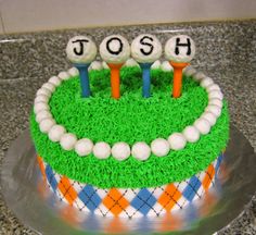 a cake decorated with grass and golf balls