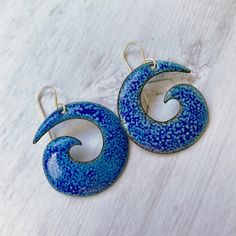 Spirals have a special place in my heart. They are beautiful organic forms created by nature. As with many natural elements, we can see more meaning in spirals than just their physical structure. The symmetry and potentially endless nature of a spiral reflects a single shell on the beach or an entire galaxy. These bold spiral copper enamel earrings will top off your beachy ensemble with flair. I heat the pieces longer to pull a lighter blue enamel through a royal blue top coat. The result: natur Nickel-free Spiral Blue Earrings, Unique Blue Spiral-shaped Jewelry, Blue Spiral, Royal Blue Top, Special Place In My Heart, Organic Forms, Fire Glass, Quick Outfits, Organic Form