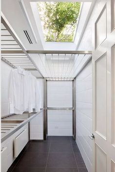 an empty walk in closet with white walls