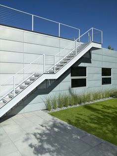 an outdoor area with grass and stairs