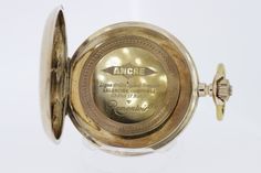 This delightful 14K Gold Pocket Watch was made back in the 1880s. The case is hand engraved with floral motifs, ferns, and griffins. It's European in design and even has the original hands with one small diamond set in the hour arm.It has an Eclipse movement, that is 17 jewel, and the dust cover is not gold.A unique feature to this watch is that it is a lever set--in order to change the time.This pocket watch is mid-grade and does show some small wear. It measures 51.51mm round and 14mm tall. It Victorian Engraved Watch With Round Dial, Victorian Engraved Watches With Round Dial, Victorian Style Engraved Watch With Round Dial, Victorian Engraved Collectible Watches, Gold Pocket Watch, Pocket Watches, Diamond Set, Floral Motifs, Dust Cover