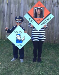 two people dressed in costumes holding up signs that say, go to jail and fail