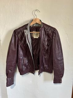 Very cool 1970's leather jacket by Berman's Leather Experts. Origin: Korea 100% Leather Shell 100% Nylon lining Era: 1970's Size: tag size reads 8 but this fits size small MEASUREMENTS Shoulders - 15" Sleeve- 22 1/2" Length, shoulder to hem: 20" Possibly never worn or only worn a couple of times. There is a small nick in the on the right shoulder on the front side. It could probably be filled in with a leather or fabric dye. See photos. Otherwise is perfect condition. I believe in fashion that is timeless not fast. Vintage clothing has a level of quality that today's clothes do not embody. Not only can it be timeless but can be reused for years to come. It's not only time to buy better quality but it is time to reduce, reuse and recycle. Let's love the world together. 🖤 #vintage #Bermans Fitted Retro Vintage Brown Leather Jacket, Fitted Vintage Brown Retro Leather Jacket, Vintage Brown Retro Leather Jacket For Winter, Retro Fitted Leather Jacket For Winter, Vintage Fitted Leather Jacket For Winter, Retro Fitted Leather Jacket, Vintage Leather Biker Jacket For Fall, Retro Vintage Brown Biker Jacket For Fall, Retro Leather Biker Jacket For Fall