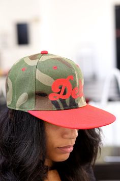 With unique designs you won't find anywhere else, our caps are the quality type that are designed with a thicker woven fabric. Not those flimsy weak ones that lose shape. 6-Panel. 100% stitched embroidered design. Flat brim. Dry clean only. Comes in: Snapback. Perfect for those Devastating Divas who need a cap for all casual, sports and/or fitness occasions. Delta Girl, Embroidered Design, Card Wallet, Woven Fabric, Diva, Trucker Hat, Unique Designs, Hats, Fabric