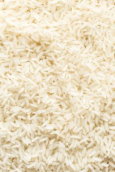 white rice is piled high in the air