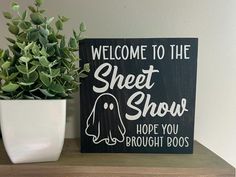 a wooden sign that says welcome to the sheet show hope you brought boos