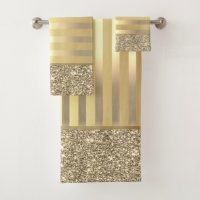 a gold and silver towel hanging on the wall