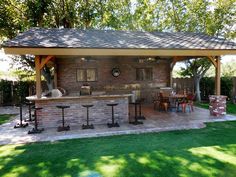 an outdoor bar is built into the side of a house