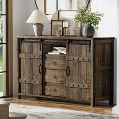 a large wooden cabinet with drawers in a living room next to a mirror and lamp