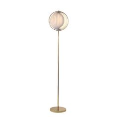 a floor lamp with a white shade on it's top and a gold base