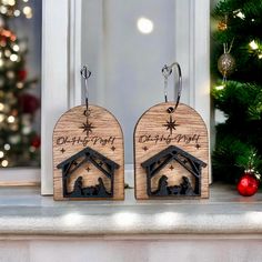 pair of wooden christmas nativity ornament on mantle