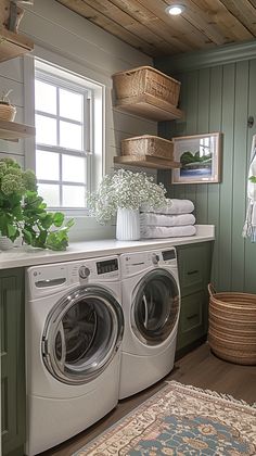 Are you looking for elegant and visually appealing ways to elevate your laundry room? Get inspired by these super chic laundry room ideas. #laundryorganizationideas Laundry Room With Plants, Laundry Room Ideas With Window Above Washer And Dryer, Nancy Meyers Laundry Room, Evergreen Fog Laundry Room, Light Green Laundry Room, Laundry Room Green Cabinets, Laundry Room With A Window, Sage Laundry Room, Cottage Style Laundry Room