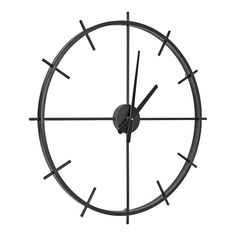 a clock that is on the side of a white wall with black hands and numbers