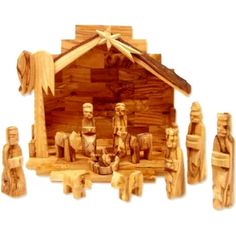 a wooden nativity scene with figurines and decorations