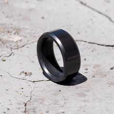 a black ring is sitting on the ground