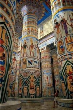 the interior of an egyptian temple with painted columns