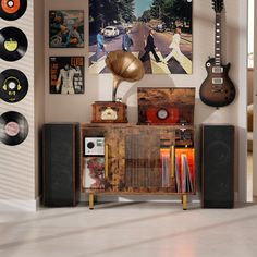 an old record player is sitting in front of a wall with pictures and guitars on it