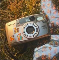 an old camera is laying on the ground