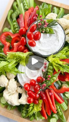 a platter filled with vegetables and dip