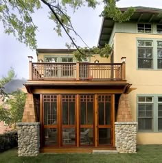 a large house with lots of windows and wooden balconies