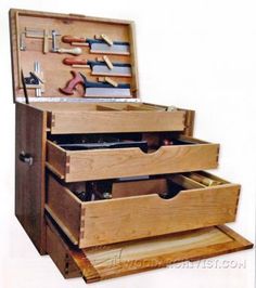 an open wooden tool box filled with tools