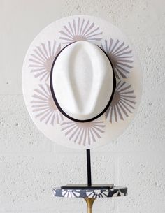 Inspired by dried palms and shaped like the sun, our Agave Nude hat is guaranteed to make a statement.Our one-of-a-kind hats are designed in Miami and hand painted in Mexico-Blocks 98% UVA-Water resistant-Sustainable-Fair trade ELASTIC: Our hats feature an internal elastic band for a comfortable fit and are designed with intricate detailing on the underside of the brim for added style.Hours of Work: 6hrs.Style Tip:-Pair your Agave Nude hat with our curated selection of linen pieces for an effort Corset Bra, Jewelry Essentials, One Piece Dress, Fair Trade, Elastic Band, Jumpsuit Dress, The Sun, Miami, Comfort Fit