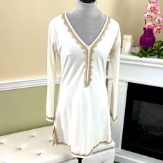 New Without Tags. Creamy White Grecian Style Long Sleeve Dress With V-Neck And Gold Metallic Edging Sewn Around V-Neck, Sleeve Cuffs, And Hemline. Dress Has Alot Of Stretch. Unique, No One Is Going Show Up To The Same Party Wearing This! Lined, Solid Material, Not See Thru. 77% Polyester, 18% Viscose, 5% Spandex. Stretch V-neck Mini Dress For Vacation, Bohemian V-neck Mini Dress For Holiday, V-neck Vacation Dress With Stretch, V-neck Stretch Dress For Vacation, Vacation V-neck Stretch Dress, Stretch V-neck Dress For Brunch, Elegant V-neck Tunic For Spring, Elegant V-neck Spring Tunic, Fitted V-neck Elegant Tunic