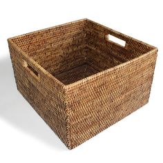 a brown basket with handles on white background