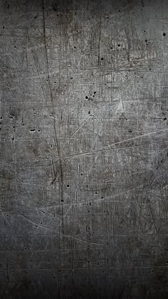 an old metal surface with scratches and rivets