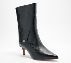 These chic midcalf booties are oh-so sophisticated with metallic hardware and a fold-over detail. Perfect for pairing with your favorite outfits, these boots are sure to become a wardrobe staple. Chic High Ankle Moto Boots For Workwear, Elegant Ankle Moto Boots For Fall, Elegant Fall Moto Boots With Pointed Toe, Elegant Fall Moto Ankle Boots, Elegant Moto Boots For Winter Workwear, Chic Mid-calf Boots For Workwear In Fall, Elegant Winter Moto Boots For Workwear, Chic Mid-calf Boots For Workwear And Fall, Chic Mid-calf Boots For Night Out