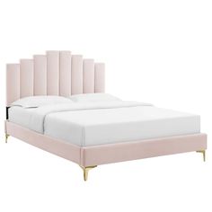 a bed with pink upholstered headboard and white sheets on the bottom side